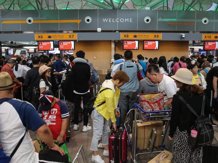 Passengers at KLIA2 in Sepang on Thursday (Aug 22) during a systems outage.