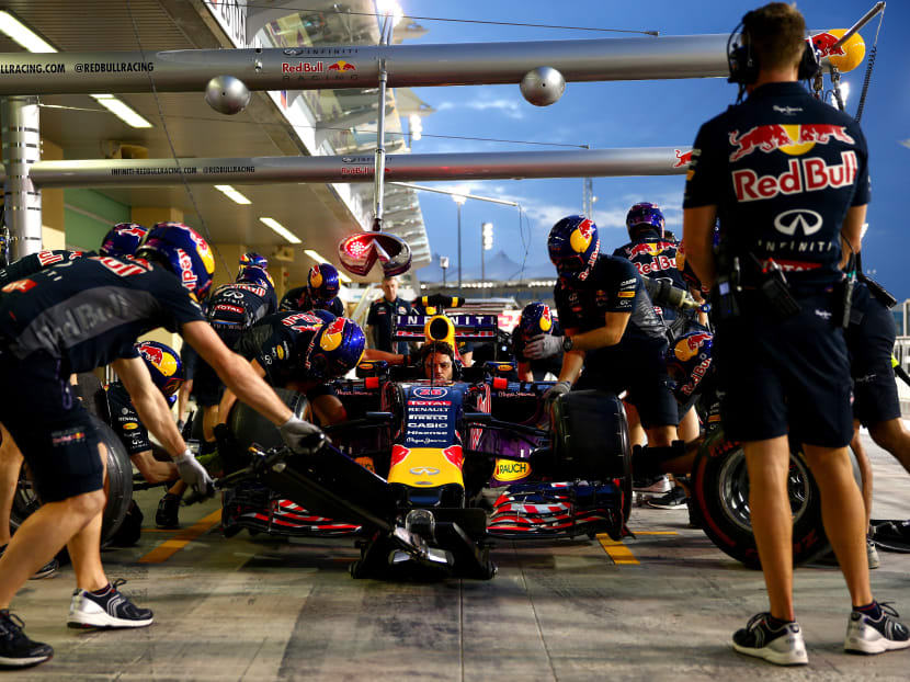 Members of the Infiniti Red Bull Racing team take part in a pit stop practice session during previews for the Abu Dhabi Formula One Grand Prix at Yas Marina Circuit on November 26, 2015 in Abu Dhabi, United Arab Emirates.  Photo: Getty Images