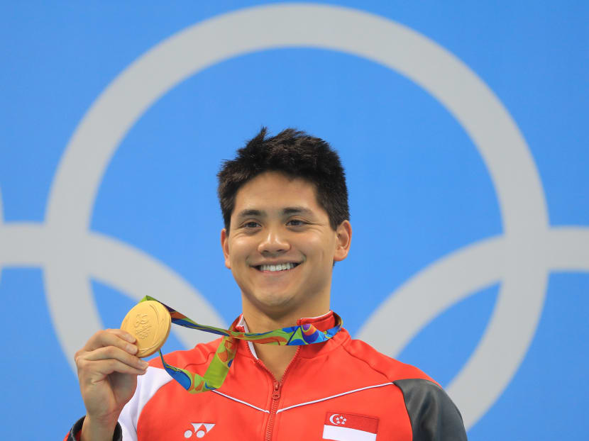 Joseph Schooling holding his gold medal at Rio 2016. Photo: Reuters
