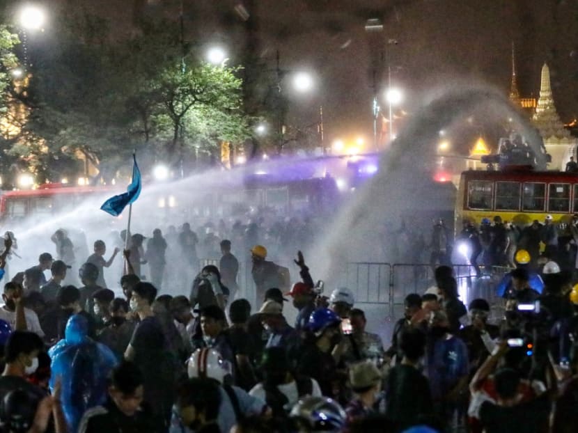 Police use water cannons on pro-democracy protesters to disperse them during an anti-government demonstration in Bangkok on Nov 8, 2020.