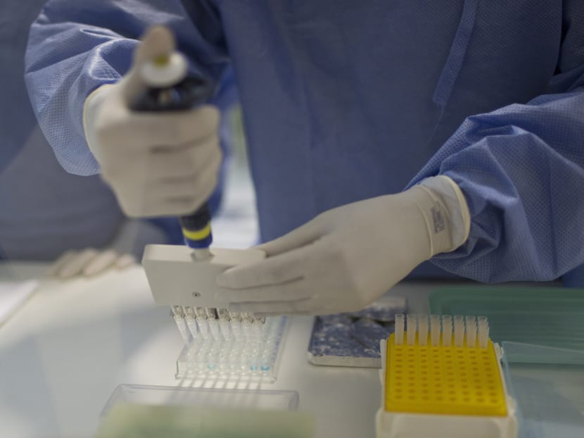 A worker identifying the Zika virus in a laboratory at the Fiocruz institute in Rio de Janeiro, Brazil. Photo: AP