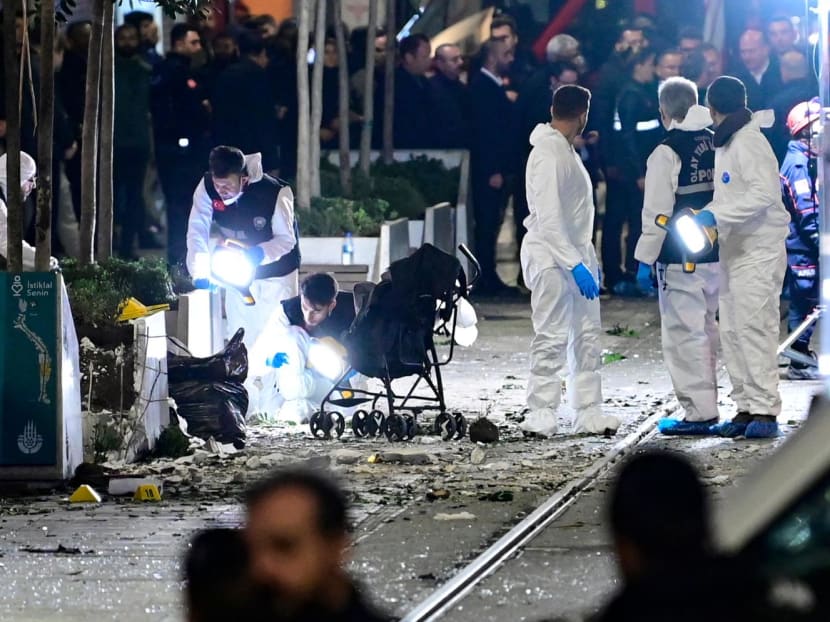 Members of a forensic team work after a strong explosion of unknown origin shook the busy shopping street of Istiklal in Istanbul, on Nov 13, 2022