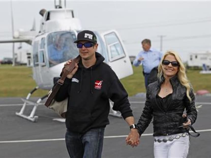 In this May 17, 2014 file photo, Kurt Busch walks with his girlfriend, Patricia Driscoll, after arriving for the NASCAR Sprint All-Star auto race at Charlotte Motor Speedway in Concord. Photo: AP