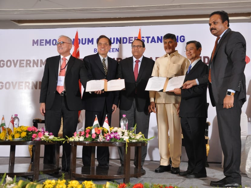 (From left) Mr Neil McGregor, Group President and Chief Executive Officer of Sembcorp Industries and Mr Miguel Ko, Group Chief Executive Officer of Ascendas-Singbridge received the letter of award for the master development rights to the Amaravati City Start-up Area from Shri Sreedhar Cherukuri, Commissioner of Capital Region Development Authority (CRDA) (standing far right). The ceremony was witnessed by Mr S Iswaran (third from left), Singapore’s Minister for Trade and Industry (Industry), Shri Chandrababu Naidu (fourth from left), the Chief Minister of Andhra Pradesh. Mr Wong Kan Seng, Chairman of Ascendas-Singbridge, also attended the ceremony. Photo: Ascendas-Singbridge