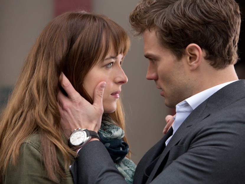 In this image released by Universal Pictures and Focus Features, Dakota Johnson, left, and Jamie Dornan appear in a scene from the film, "Fifty Shades of Grey." Photo: AP