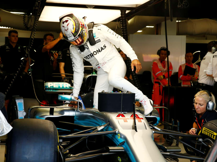 Mercedes' Lewis Hamilton stepping in to his car during practice during the recent Singapore Grand Prix weekend.  Photo: REUTERS