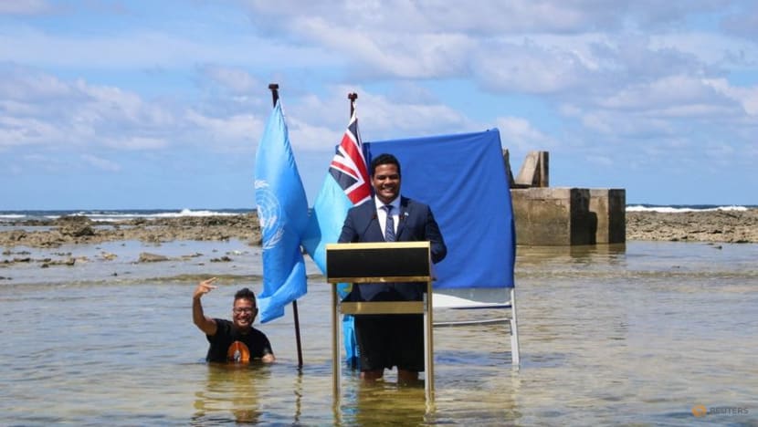 Tuvalu minister stands in sea to film COP26 speech to show climate change Tuvalu minister stands in sea to film COP26 speech to show climate change