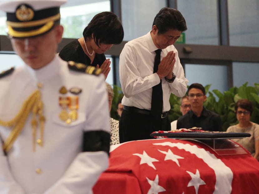 Japan's Prime Minister Shinzo Abe pays respects to the late former President S R Nathan, whose body is lying in state, at Parliament House on Aug 25, 2016. Photo: Jason Quah