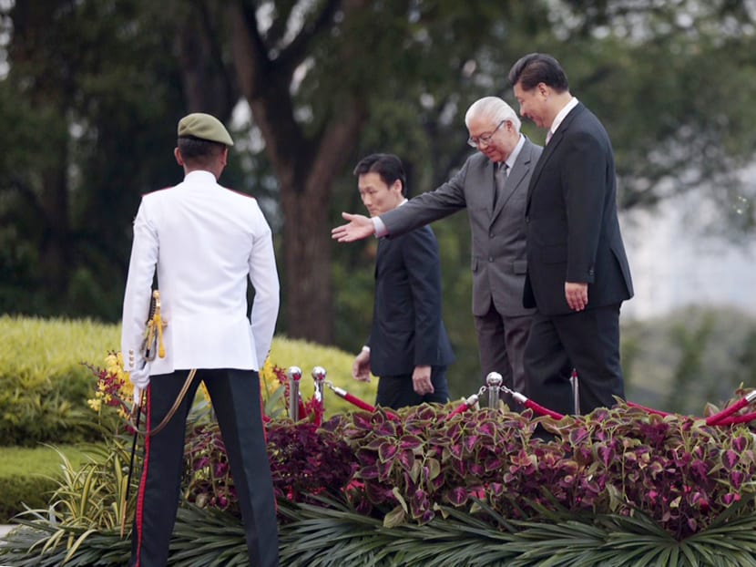 President Tony Tan welcoming Chinese President Xi Jinping at the Istana on Nov 6, 2015. Dr Tan later hosted a state banquet for Mr Xi and his wife, Madam Peng. Photo: Jason Quah