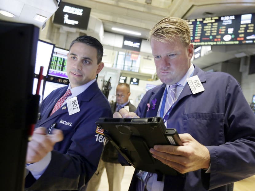 Wall Street opened firm yesterday (Aug 27), rising 1.4% in the first few minutes after Wednesday’s 4% jump, the highest since 2011. Photo: AP