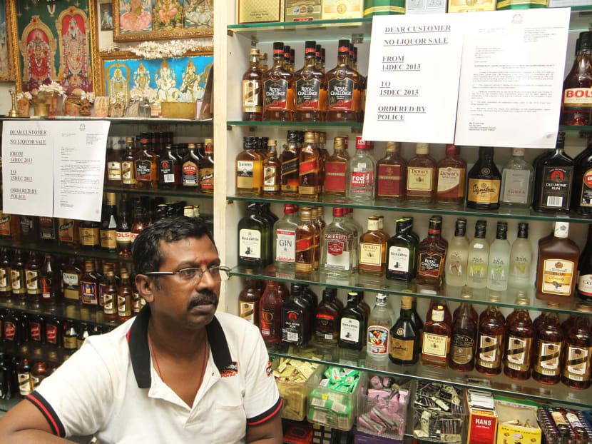 A shop in Little India called Home of Spices has put up notifications instructing of a 2-day ban in the sales and consumption of alcohol in Little India on shelves displaying alcoholic drinks on 13 Dec 2013. Photo by OOI BOON KEONG