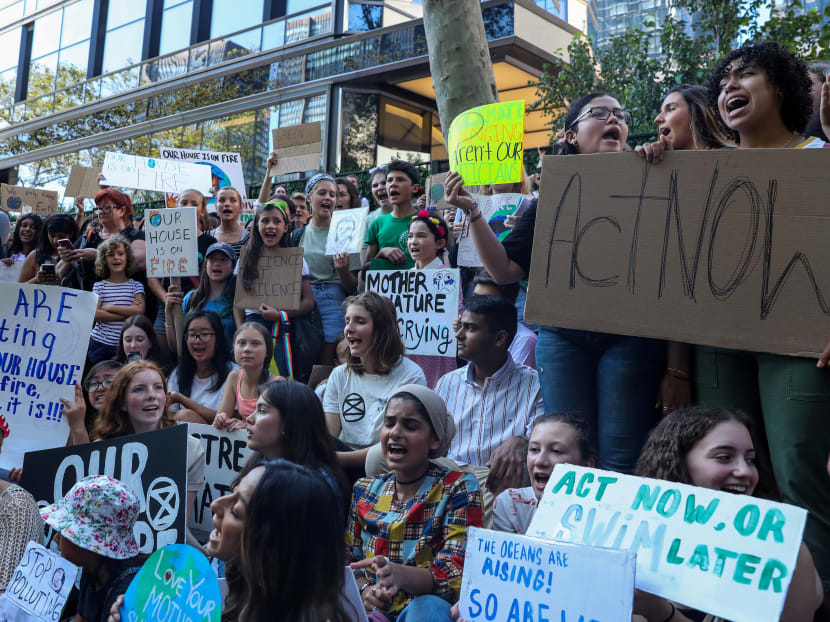 Swedish activist Greta Thunberg (centre, in orange top) participating in a youth climate change protest in front of the United Nations headquarters in Manhattan, New York, on Aug 30, 2019.