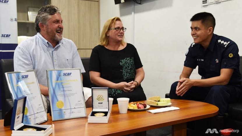 Australian couple on holiday gets SCDF award for saving drowning boy Australian couple on holiday gets SCDF award for saving drowning boy
