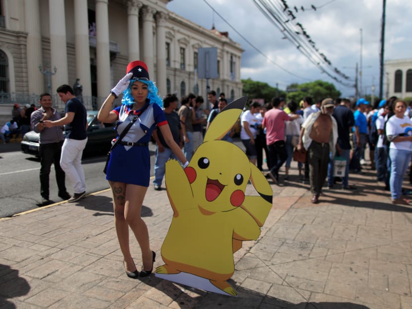 A cosplayer in El Salvador dressed as a character of the augmented reality mobile game Pokemon Go. Photo: Reuters