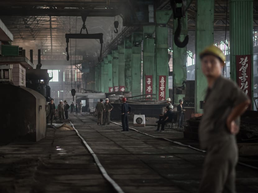 A photo taken on July 22, 2017 shows workers at the Chollima Steel Complex, south-west of Pyongyang. The Chollima Steel Complex has around 8,000 staff and is one of the biggest in North Korea, operating in a sector vital to the economy of the isolated, sanctions-hit country. Photo: AFP