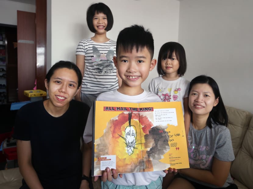 Fong Git Yu (centre) pictured with his family. He is the author and illustrator of a zine about endangered animal species, which he co-created with artist Lee Wan Xiang (left).