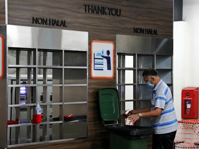 A diner returns his tray at the Market Street Interim Hawker Centre on Sept 1, 2021, the day enforcement action against table littering at hawker centres kicked in. A diner returns his tray at the Market Street Interim Hawker Centre on Sept 1, 2021, the day enforcement action against table littering at hawker centres kicked in.