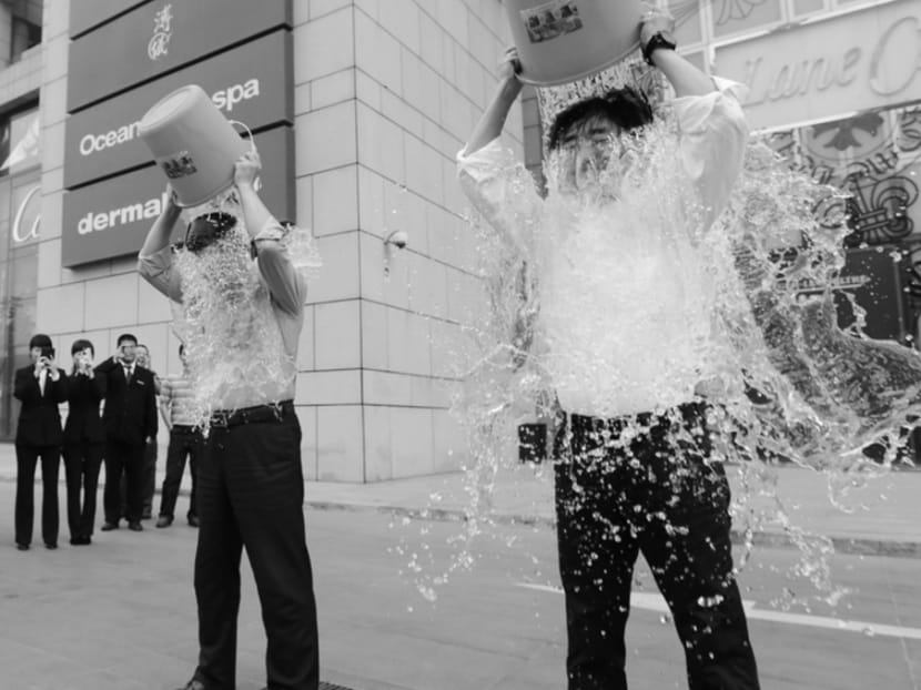 People doing the "ice bucket challenge" to raise money for research into amyotrophic lateral sclerosis.