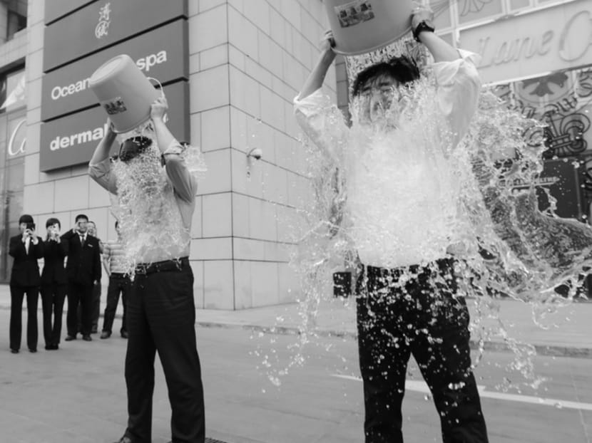 People doing the "ice bucket challenge" to raise money for research into amyotrophic lateral sclerosis. People doing the "ice bucket challenge" to raise money for research into amyotrophic lateral sclerosis.