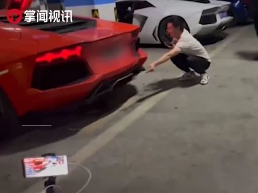 Chinese portal Sohu.com reported that the owner and his friends had gathered around the orange coloured sports car in an underground car park in Changsha in Hunan Province for the “cookout”. Chinese portal Sohu.com reported that the owner and his friends had gathered around the orange coloured sports car in an underground car park in Changsha in Hunan Province for the “cookout”.
