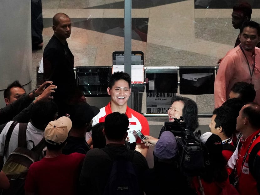 Joseph Schooling fielding questions from Singapore and Malaysia media after arriving at Kuala Lumpur International Airport on August 18, 2017. Photo: Jason Quah