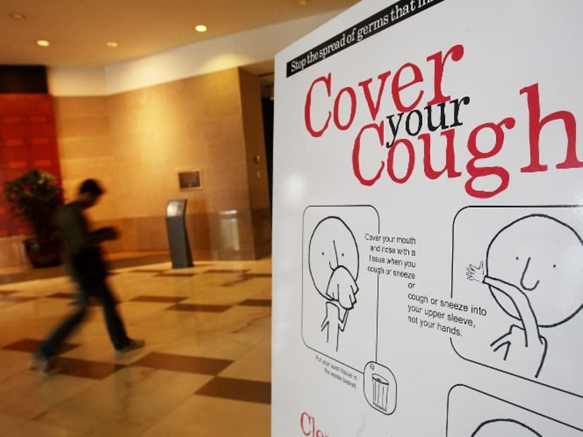 This file photo shows a government sponsored poster warning of the spread of the flu in an office building in New York City. Photo: AFP