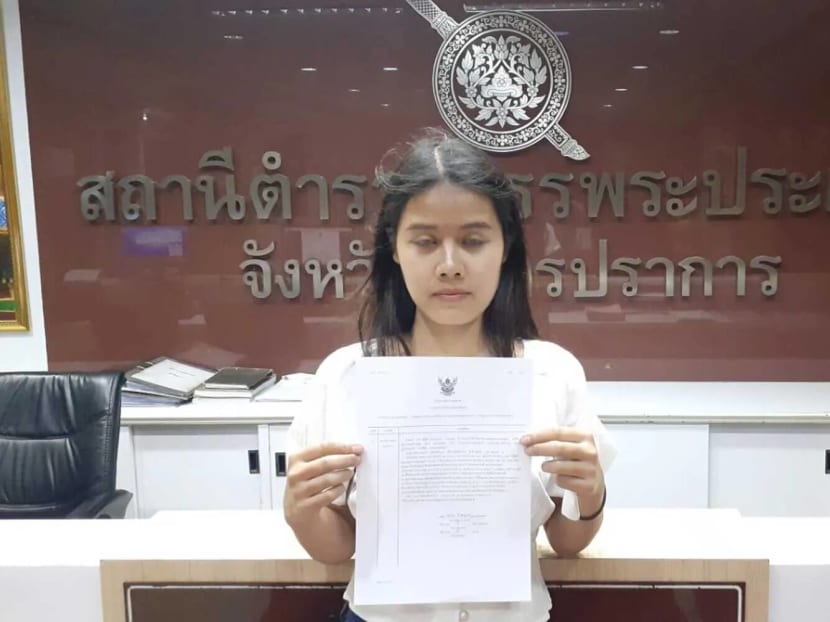 Ms Pornthida Chamnanwet, 23, shows her written complaint that her husband had taken off with their winning 6 million baht lottery ticket, at Phra Pradaeng police station in Samut Prakan on Sunday (Nov 17) night.