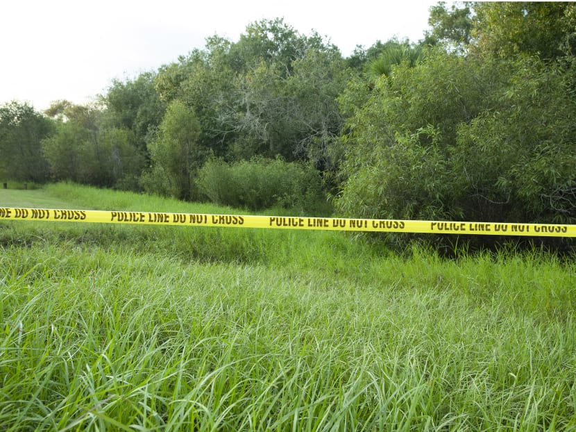 Police tape restricts access to Myakkahatchee Creek Environmental Park on Oct 20, 2021 after the FBI announced human remains and personal items belonging to Mr Laundrie have been found there.