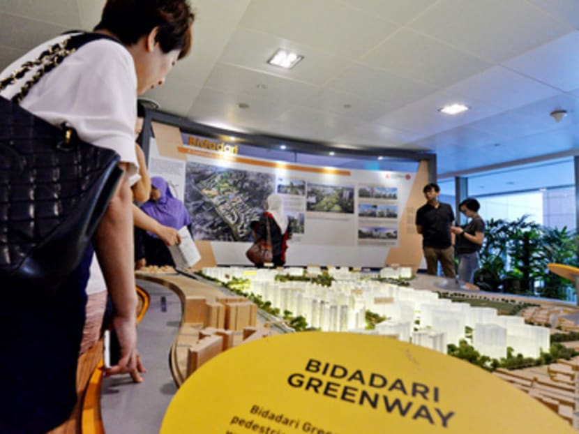 People looking at models of Build-To-Order flats at Bidadari. Although it is on the site of a former cemetery, a five-room flat there is priced as high as S$633,000. TODAY file photo