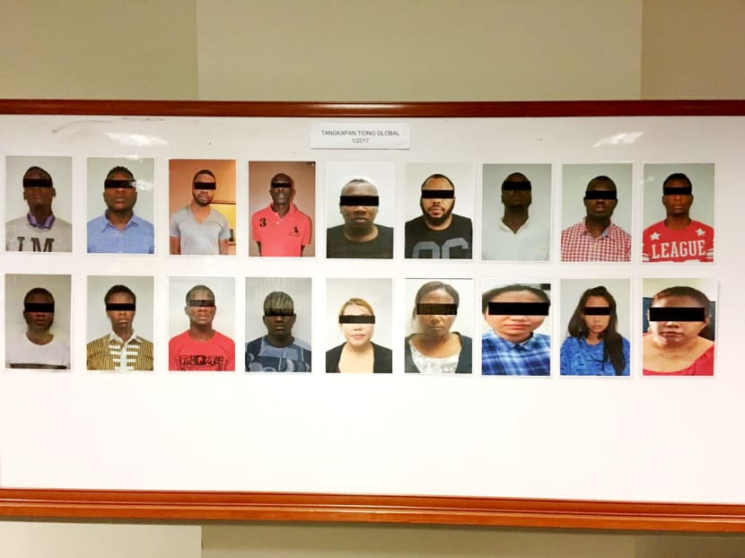 Suspects arrested during a joint-operation between Malaysia and Singapore’s police against Internet  love scams. The public is advised to be extra cautious when making friends online. Photo: Singapore Police Force