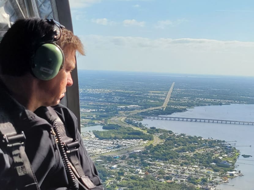 The Governor of Florida, Mr Ron DeSantis, tours the area over Piney Point after an emergency was declared after a leaking toxic wastewater reservoir, threatened nearby homes and an environmental disaster, near Tampa Bay, Florida, US on April 4, 2021. The Governor of Florida, Mr Ron DeSantis, tours the area over Piney Point after an emergency was declared after a leaking toxic wastewater reservoir, threatened nearby homes and an environmental disaster, near Tampa Bay, Florida, US on April 4, 2021.