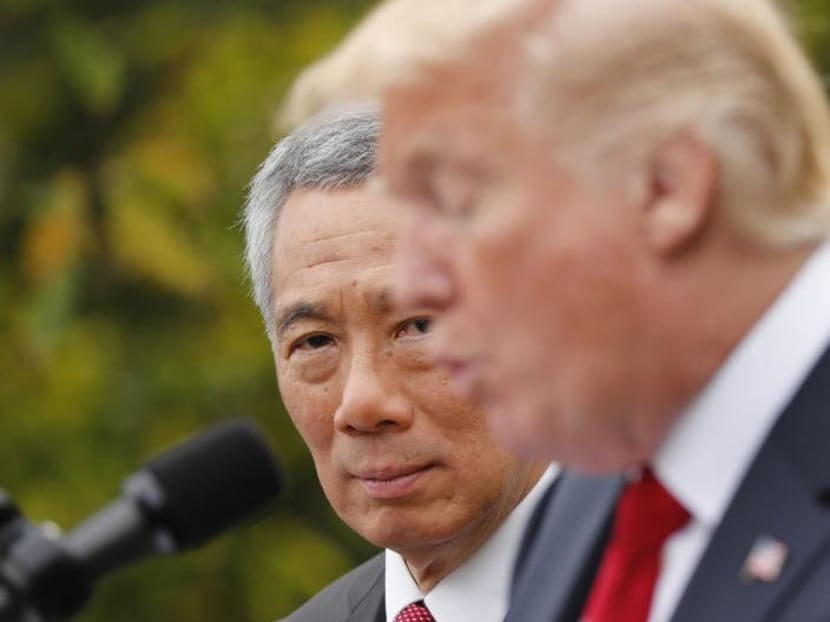 Singapore's Prime Minister Lee Hsien Loong and US President Donald Trump give joint statements in the Rose Garden of the White House in Washington, October 23, 2017. Photo: Reuters Singapore's Prime Minister Lee Hsien Loong and US President Donald Trump give joint statements in the Rose Garden of the White House in Washington, October 23, 2017. Photo: Reuters