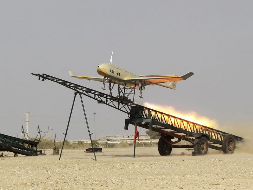 In this picture released by Jamejam Online on Thursday, Dec. 25, 2014, an Iranian made drone is launched during a military drill in Jask port, southern Iran. Iran's national army has begun a massive military drill near the strategic Strait of Hormuz at the entrance to the Persian Gulf, state TV reported on Thursday. Photo: AP