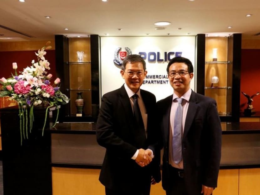 (Left) Commercial Affairs Department director David Chew and Embassy of China Counsellor and Consul-General Wang Jiarong at a meeting in July 2018.