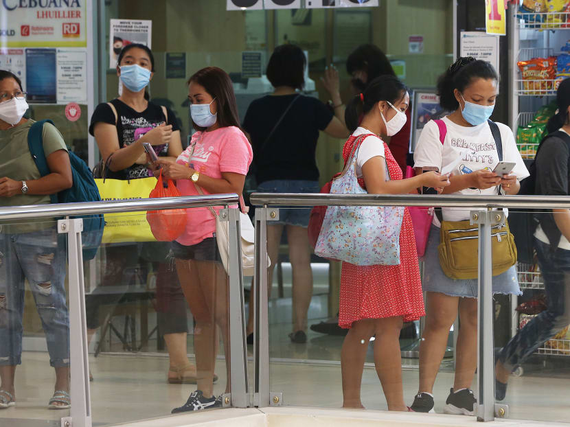 Domestic workers at Lucky Plaza along Orchard Road on their day off, on May 2, 2021.