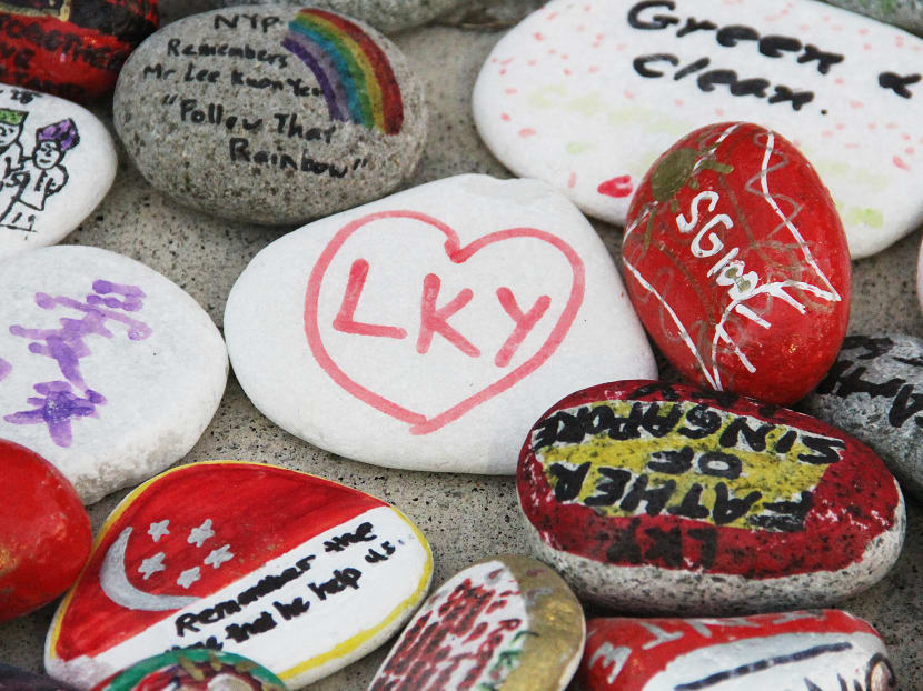 At the Community Memorial Garden at Bishan Park last week, residents gathered to pen their memories of Mr Lee Kuan Yew, and their hopes and aspirations for Singapore, with words and drawings on pebbles. Photo: Damien Teo/TODAY
