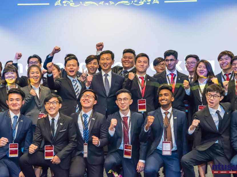 The author, seen here standing to the right of Education Minister Ong Ye Kung at The First Step conference in January 2019, says that  getting employers to go beyond academic results in their hiring process is a key concern of undergraduates.