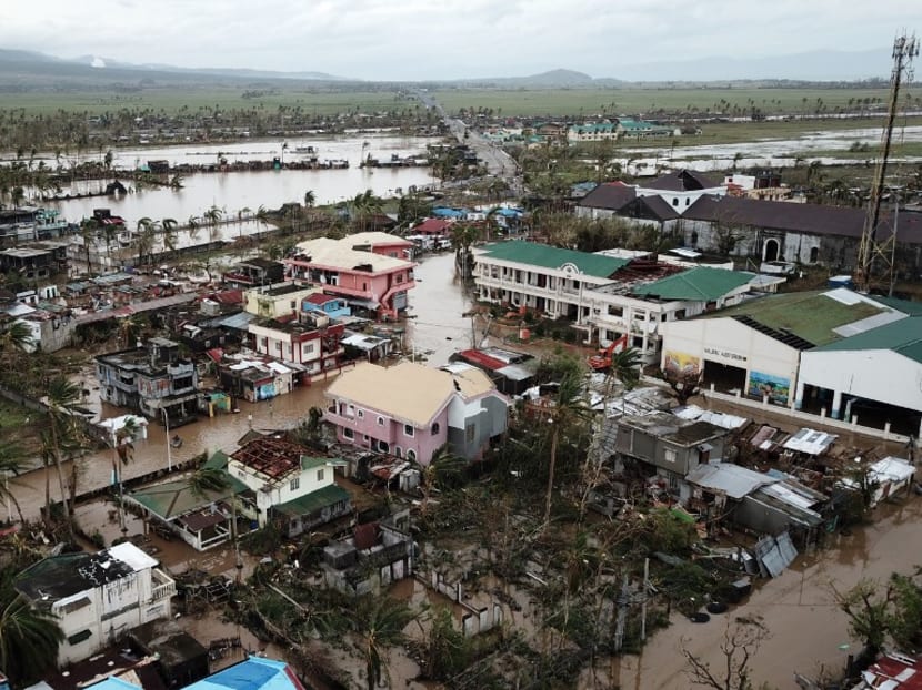 An aerial view shows destroyed and flooded houses after super Typhoon Goni hit the town of Malinao, Albay province, south of Manila on Nov 1, 2020.