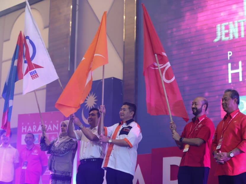 Leaders from the opposition Pakatan Harapan (PH) pact wave their party flags during its convention in January. Social media research firm Politweet predicts that PH can only form a stable federal government if it can win more seats in East Malaysia. Photo: Malay Mail Online