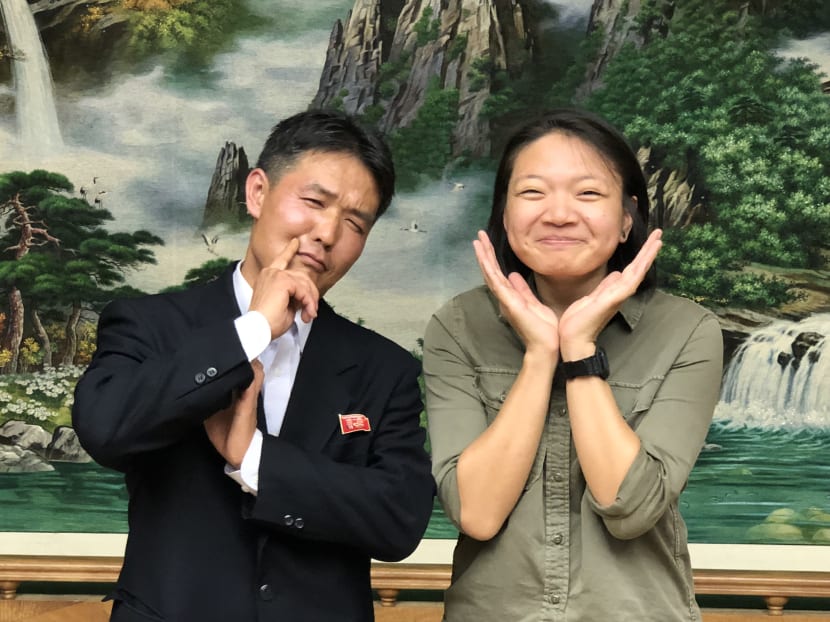 Mr So Myong Dok, senior officer in the department of South-east Asia in the Korea Committee for the Promotion of International Trade, and TODAY journalist Wong Pei Ting have a funny photo taken on Sept 21, 2018.