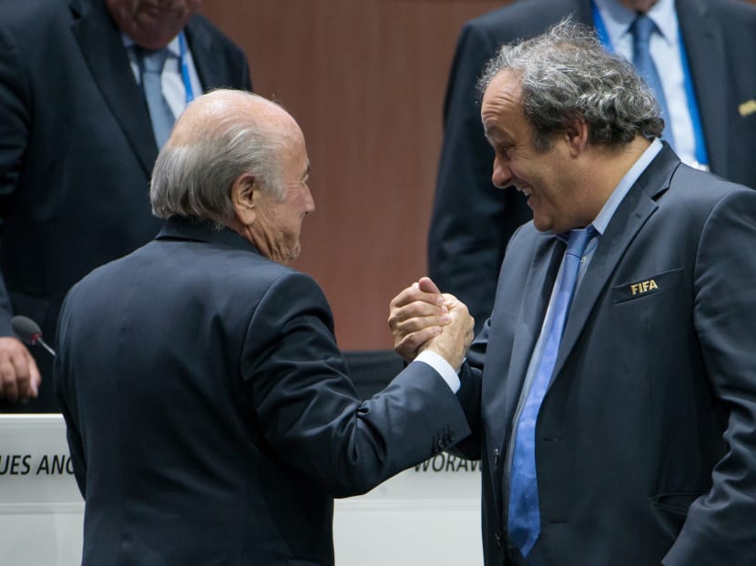 UEFA president Michel Platini shakes hands with FIFA President Joseph S. Blatter during the 65th FIFA Congress at Hallenstadion on May 29, 2015 in Zurich, Switzerland. Photo: Getty Images