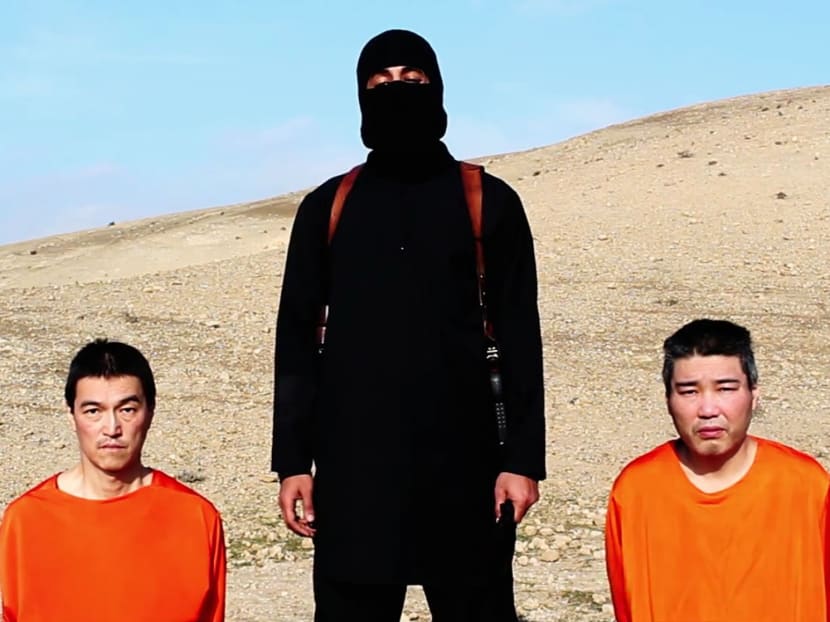 This image taken from an online video released by the Islamic State group's al-Furqan media arm on Tuesday, Jan. 20, 2015, purports to show the group threatening to kill two Japanese hostages that the militants identify as Kenji Goto Jogo, left, and Haruna Yukawa, right, unless a $200 million ransom is paid within 72 hours. Photo: AP