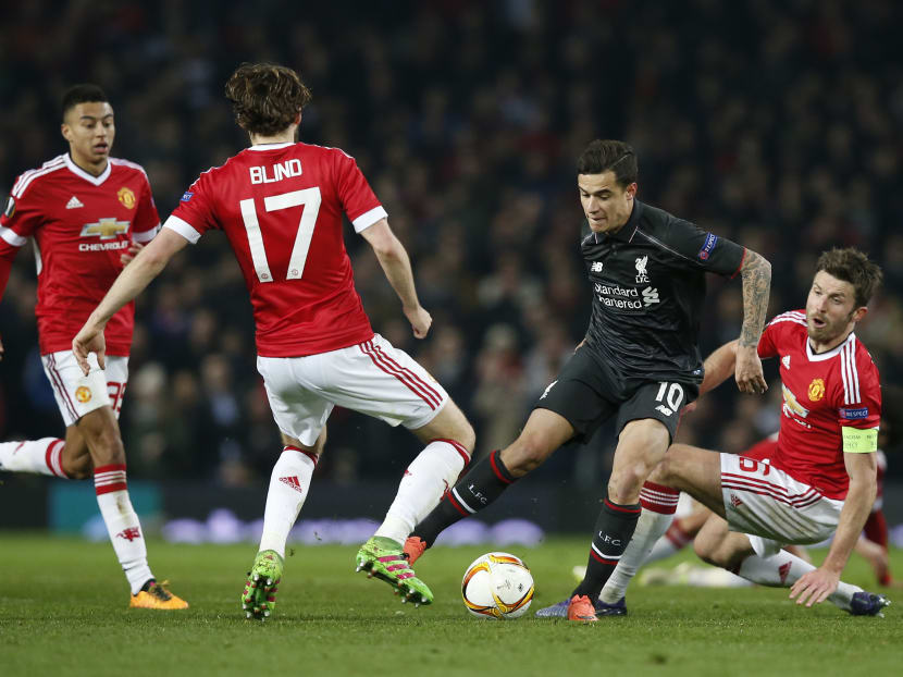 Liverpool's Philippe Coutinho in action with Manchester United's Michael Carrick and Daley Blind. Photo: Reuters