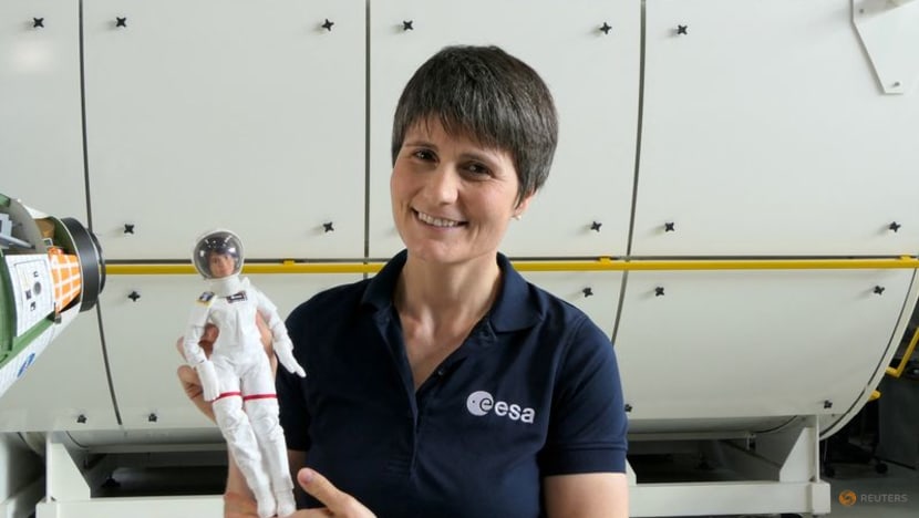 Space station's Italian commander, with lookalike Barbie, tells girls about science in orbit Space station's Italian commander, with lookalike Barbie, tells girls about science in orbit