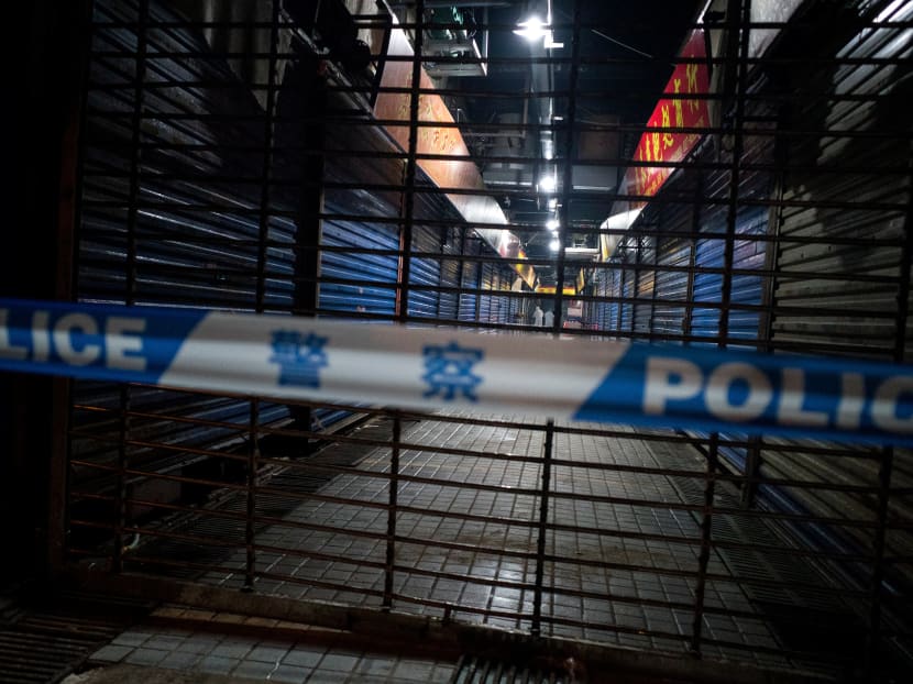 Members of staff of the Wuhan Hygiene Emergency Response Team conduct searches on the closed Huanan Seafood Wholesale Market in the city of Wuhan, in the Hubei Province, on Jan 11, 2020. The first Covid-19 cases were reported in Wuhan.