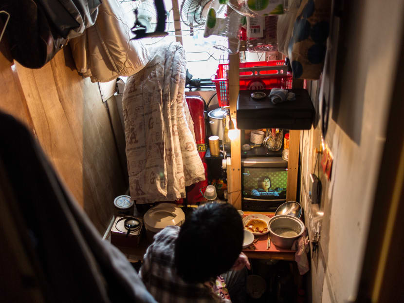 Hong Kong's working poor choose streets over dismal housing