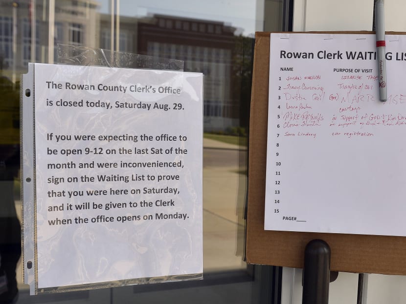A sign and sign-in sheet is placed at the door of the Rowan County Courthouse  in Morehead, Ky., Saturday, Aug 29, 2015. Although normally open on the last Saturday of the month, Rowan County Clerk Kim Davis decided not to open the office due to a rally being held on the lawn. Photo: AP