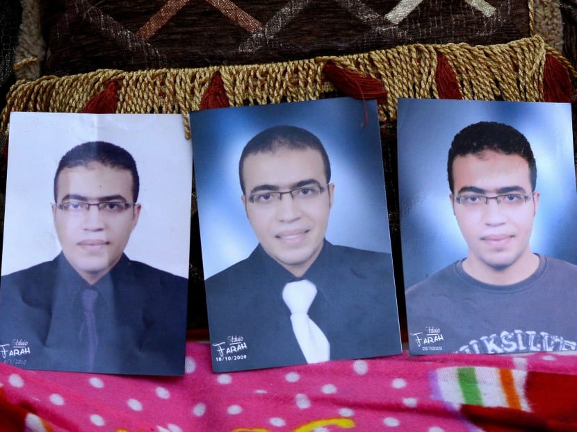 Portraits of Mr Abdallah El-Hamahmy, an Egyptian suspected of being the machete attacker in Paris's Louvre museum, placed on a sofa at the family home in Mansura, Egypt. Photo: AFP