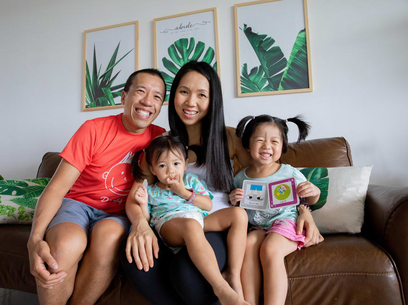 The author with her husband Cliff Tam and their daughters in their home on June 24, 2021.