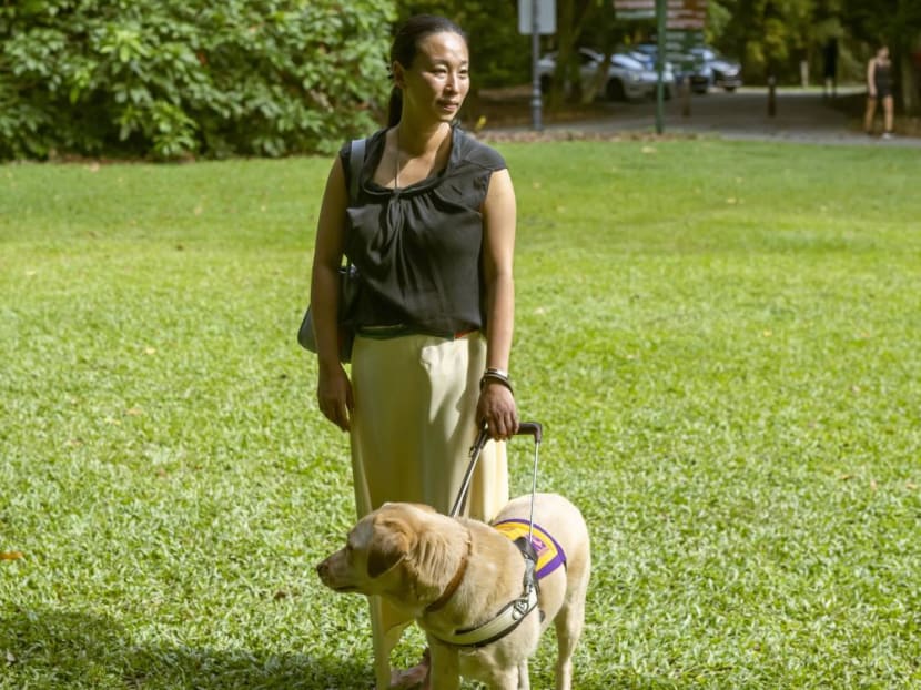 The author, Cassandra Chiu, with her assistance dog Elke.